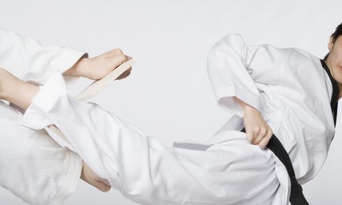 Close-up of a woman practicing kickboxing